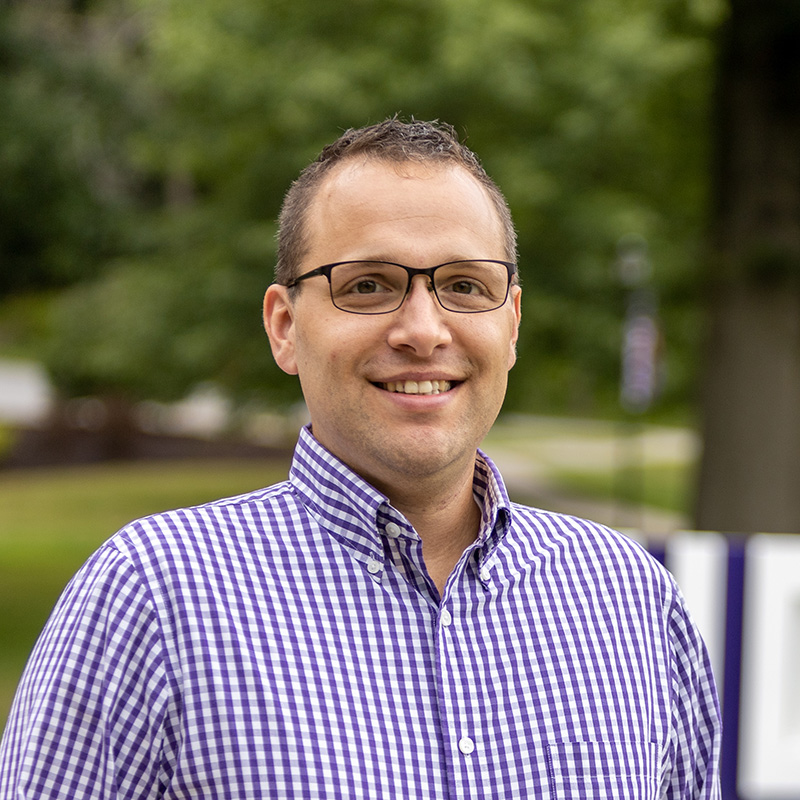 Portrait of Kevin Dibble standing outside on Houghton's campus.