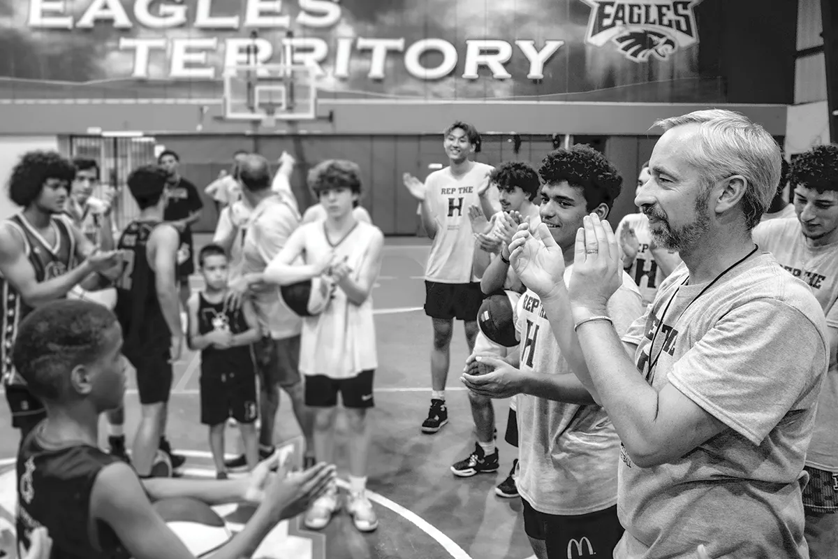 Houghton men's basketball coach Jeremy Bialek coaching his team in Guaynabo.