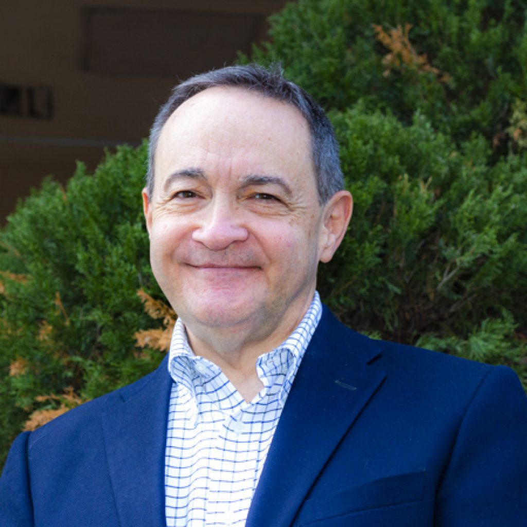 Andrew Westmoreland with blue suit coat. Houghton's 2025 commencement speaker.