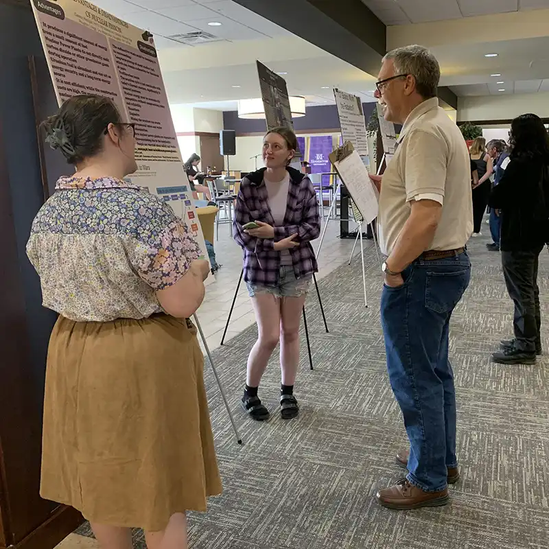Students presenting at undergraduate research day at houghton.